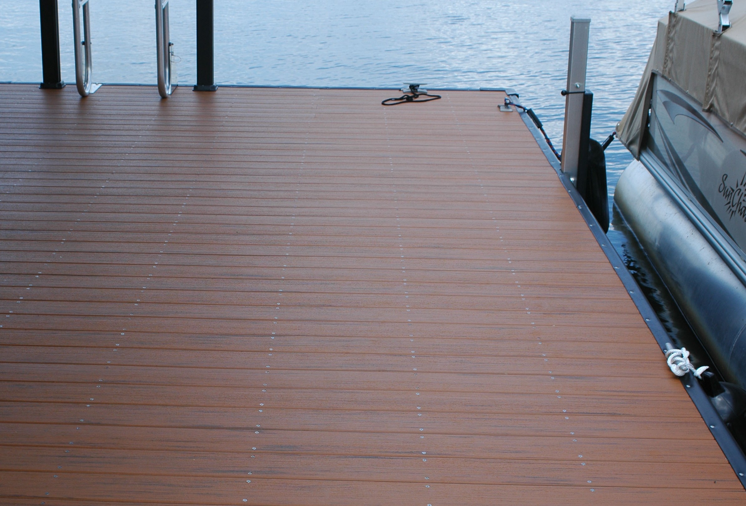 Vinyl deck boards on a covered dock beside the lake